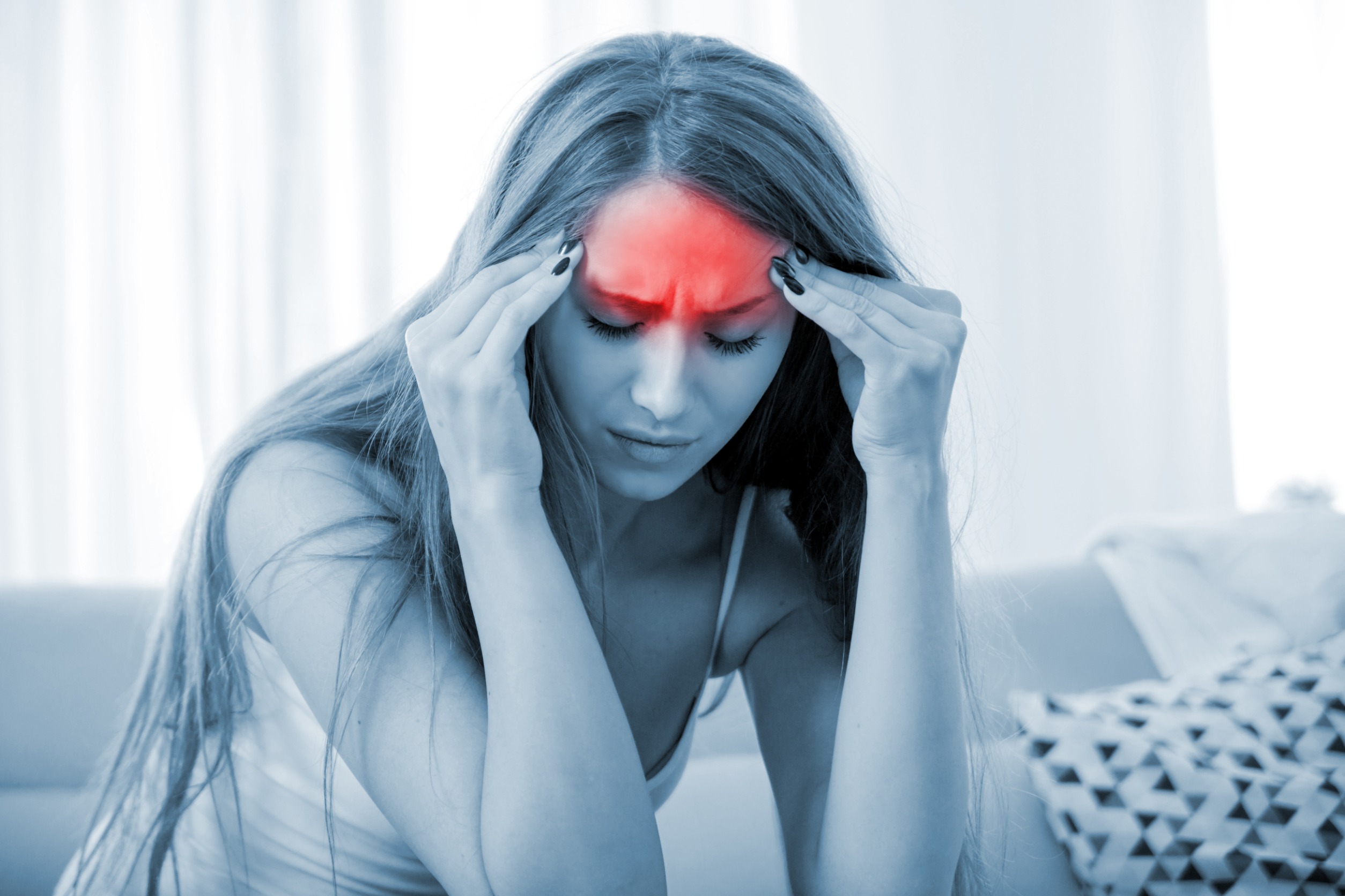 Image of a woman with headache pain.